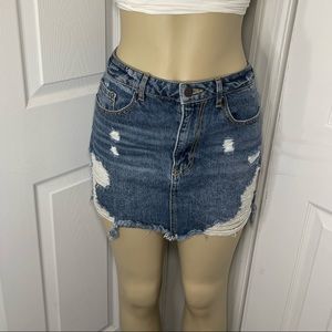 Jean skirt with rips, accessible pockets in front & back